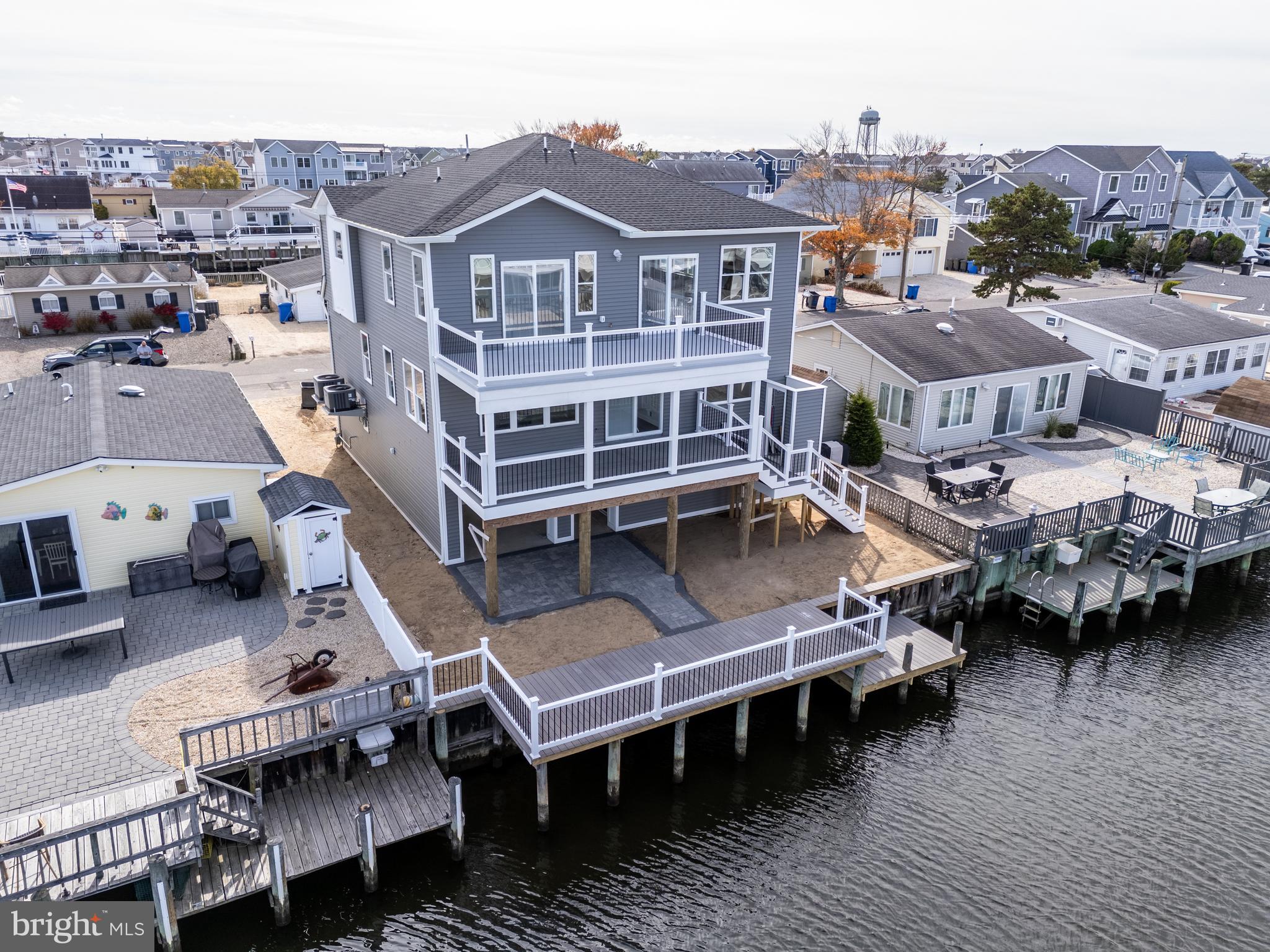 an aerial view of a house with roof deck outdoor seating