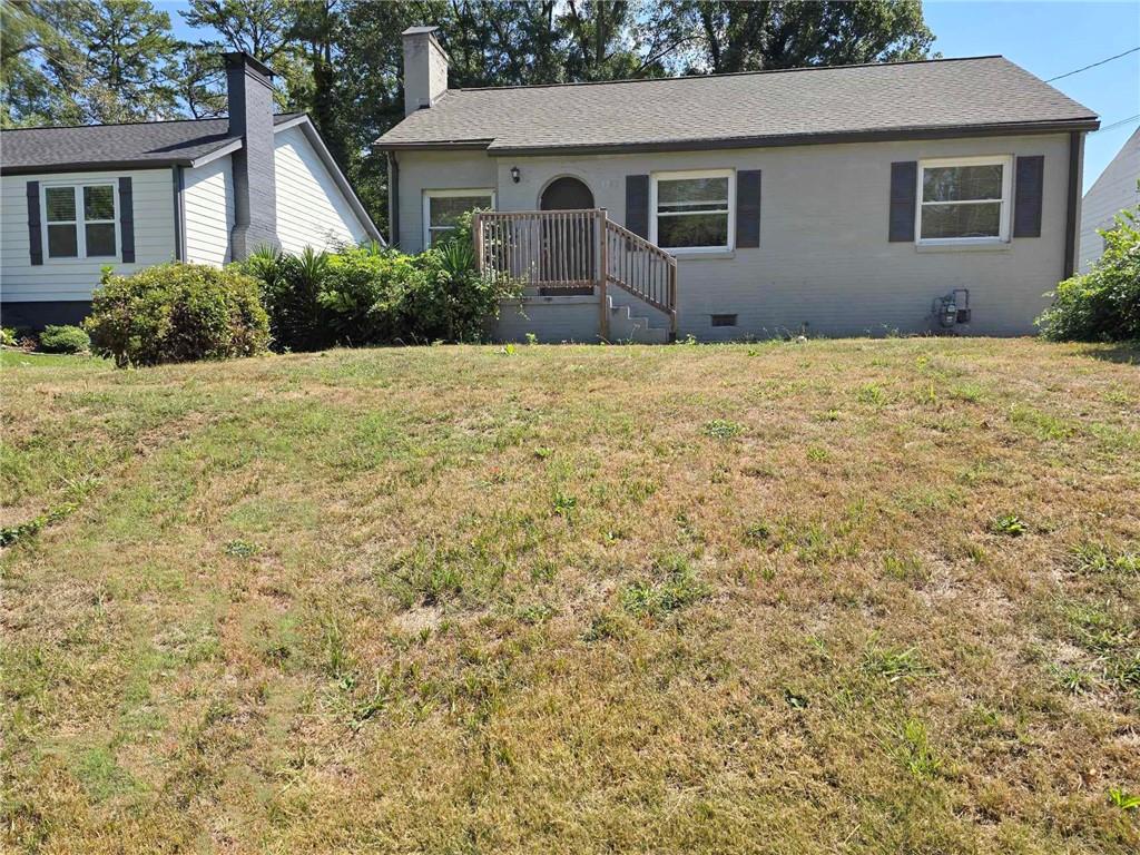 a front view of a house with yard