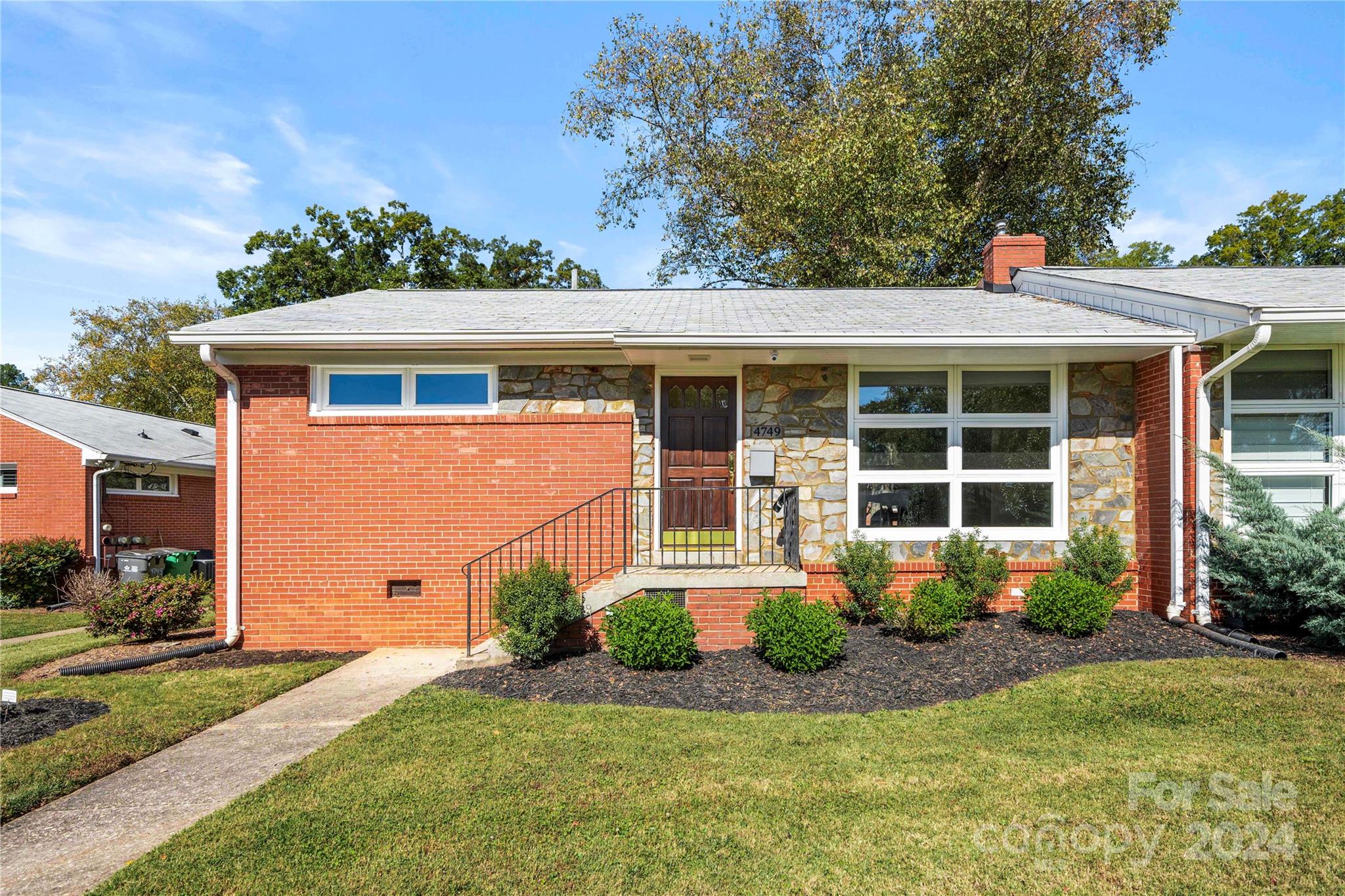 front view of a house with a yard