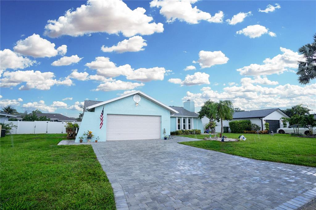 a view of a house with a yard