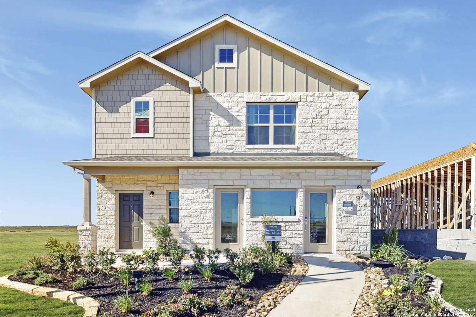 front view of a house with a yard