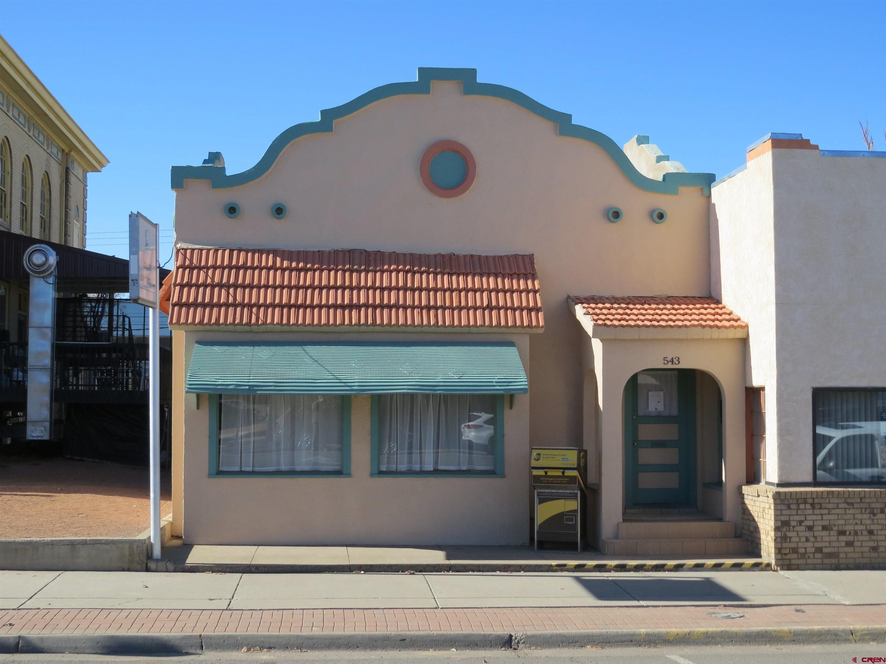 a front view of a house with entryway and garage