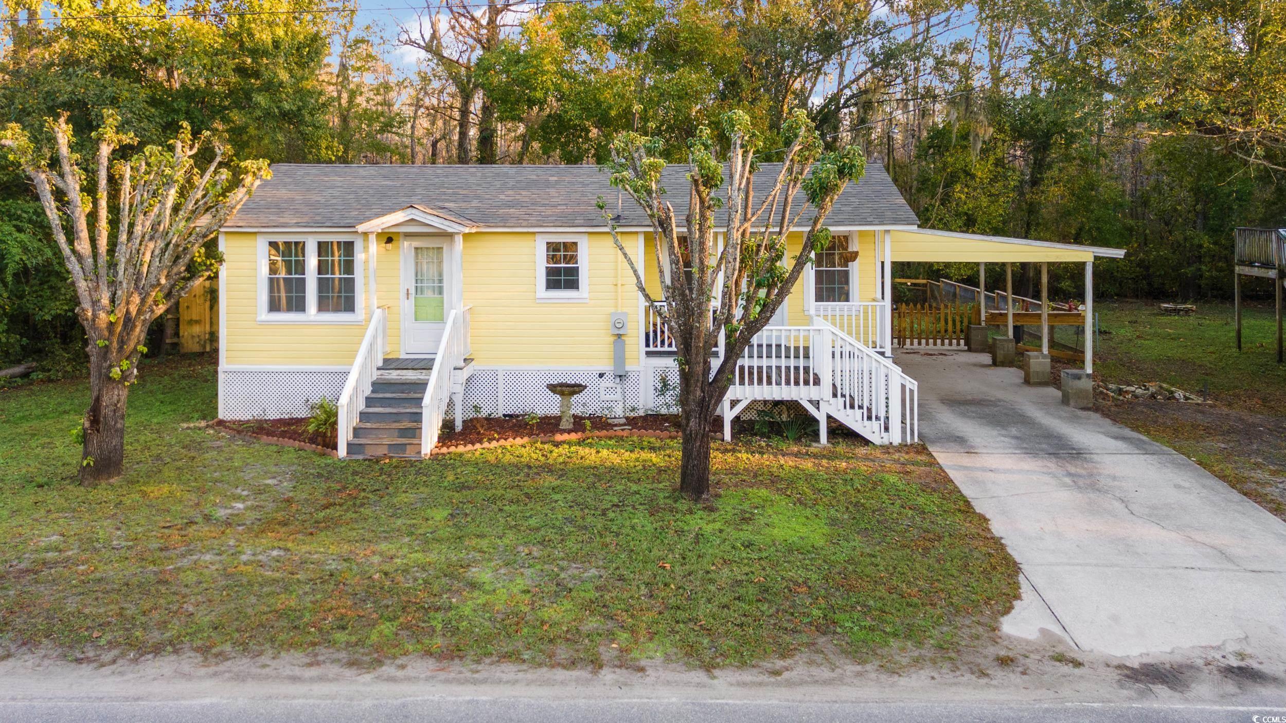 View of front of property featuring a front yard a