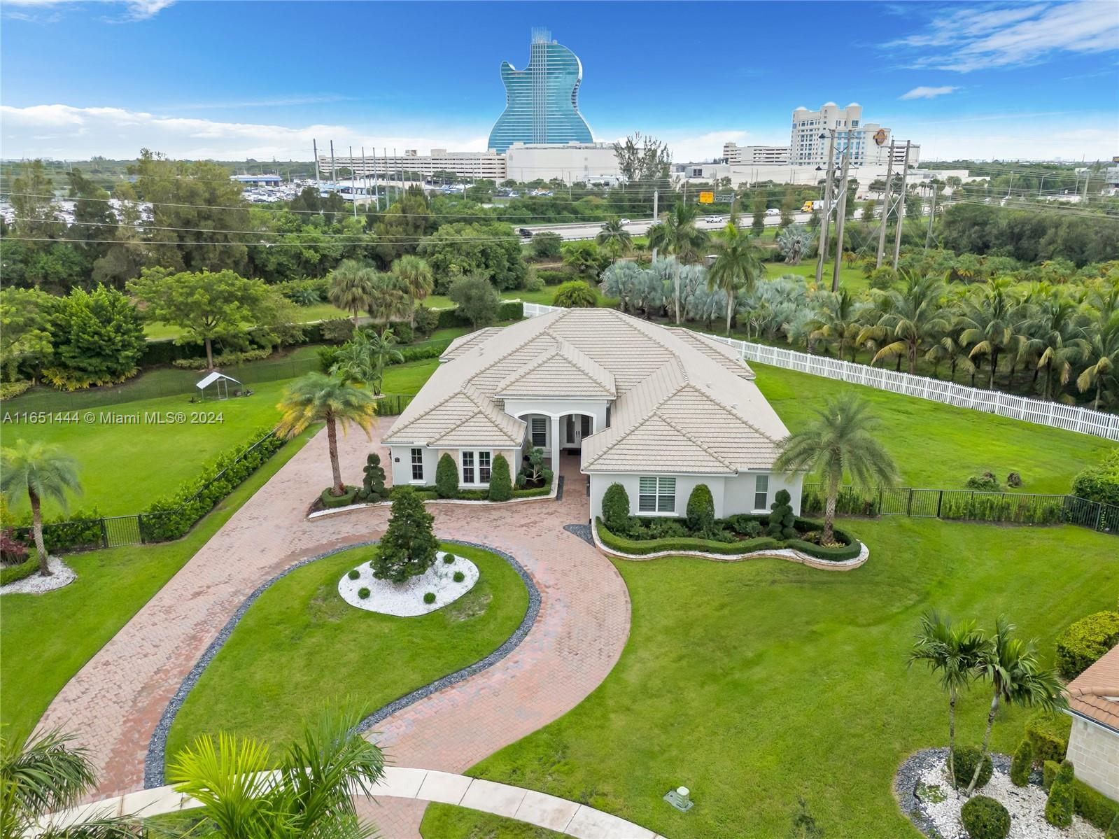 an aerial view of a house with outdoor space and street view