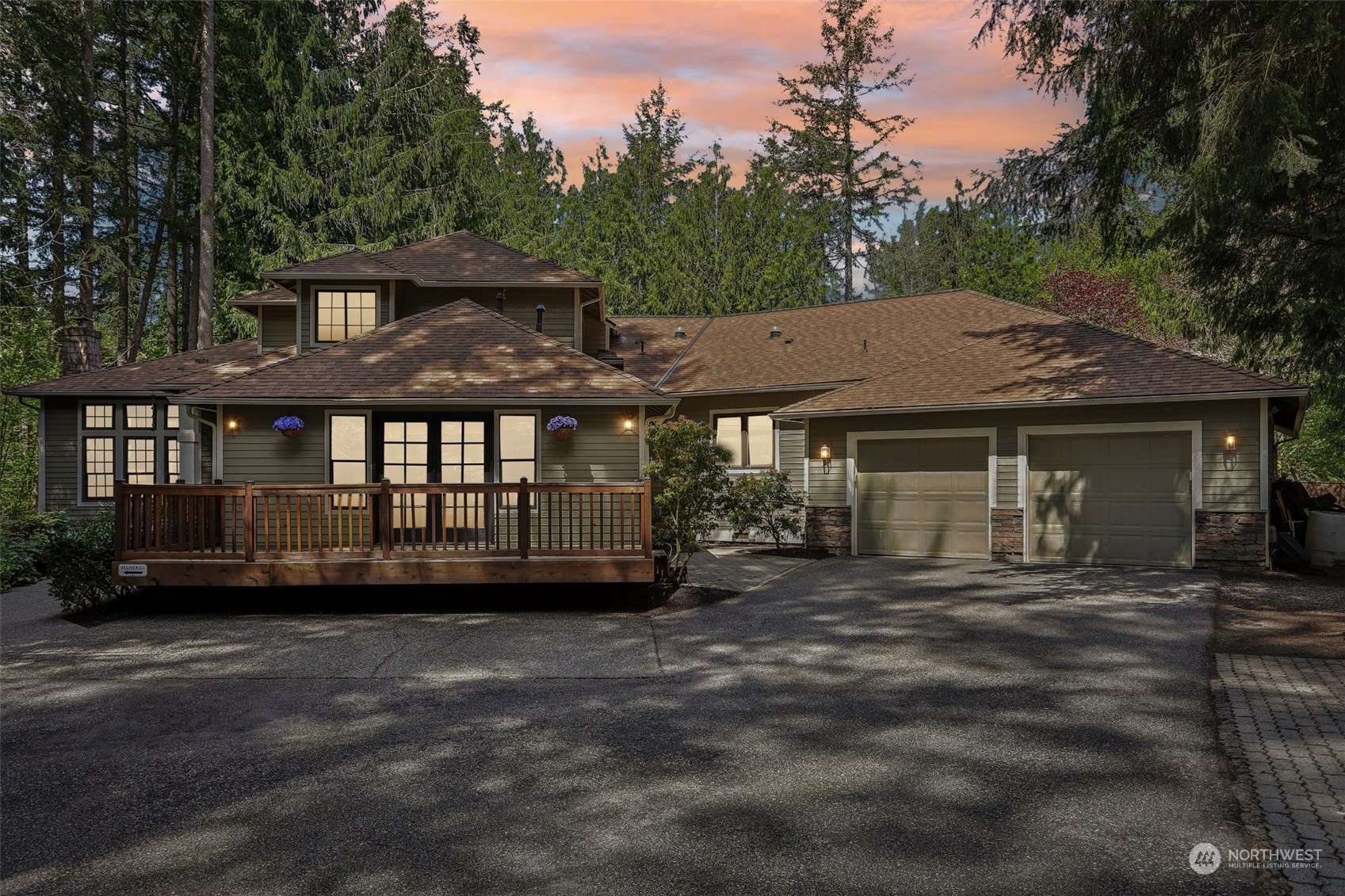 a view of a house with a yard and sitting area