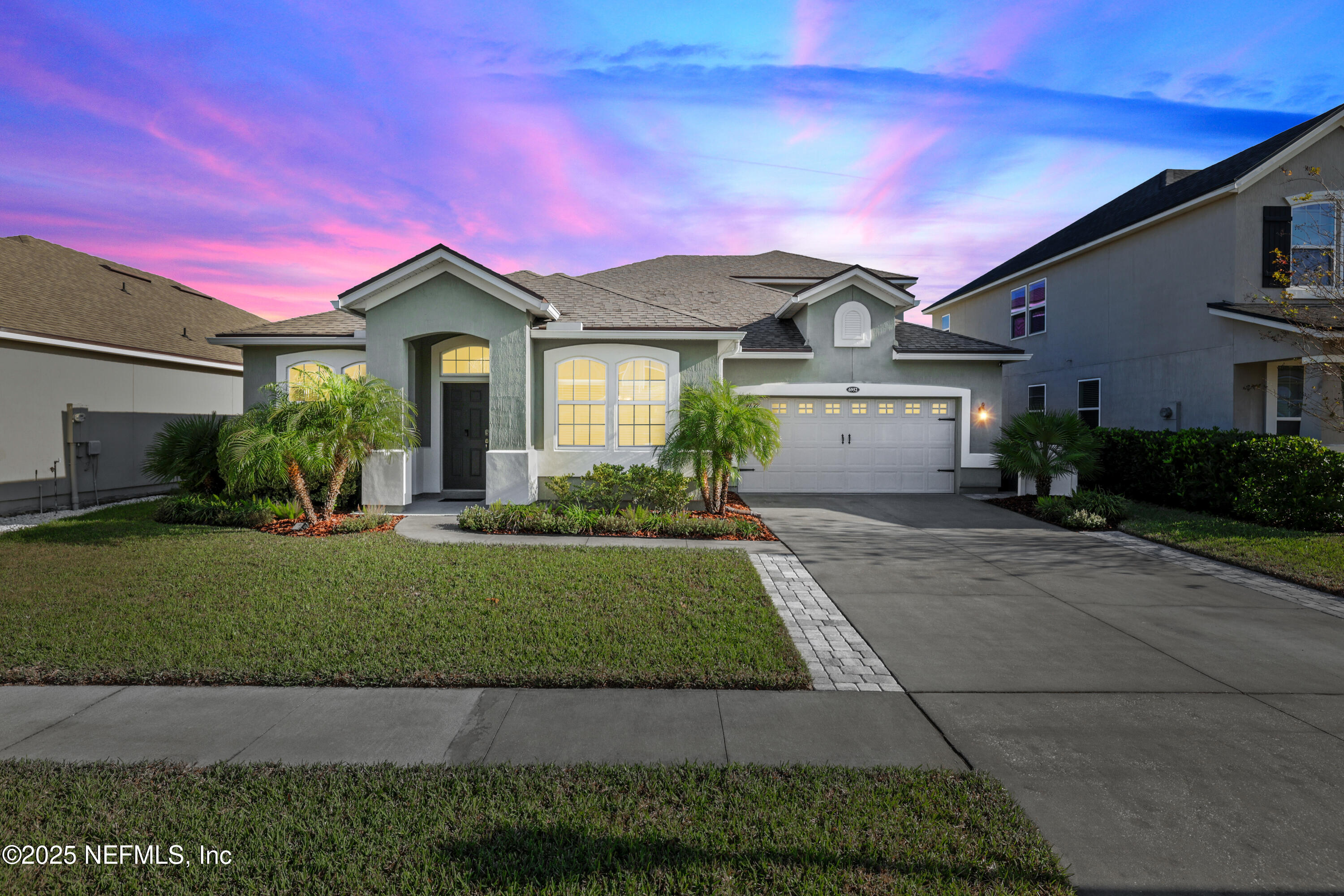 a front view of a house with a yard