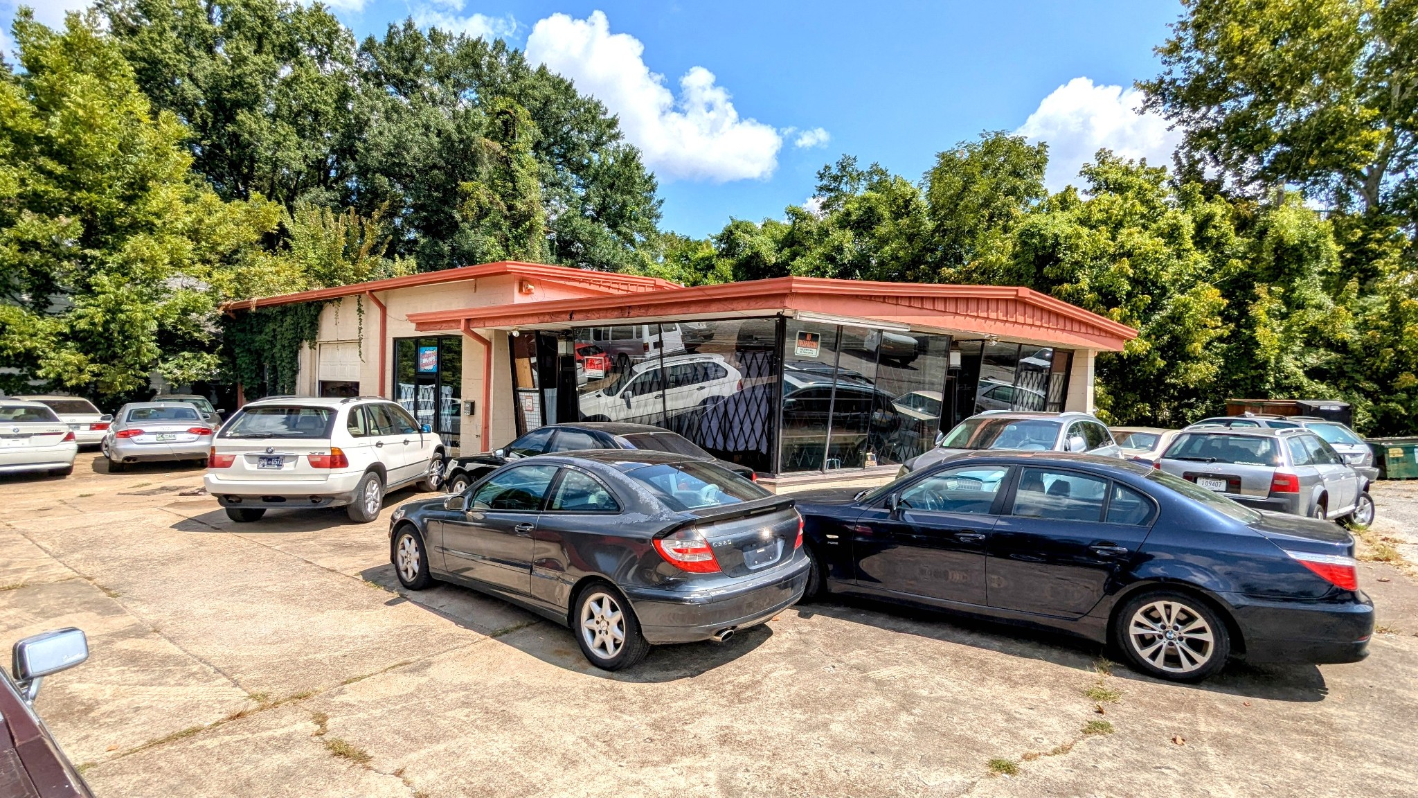 a view of a cars park in front of a house