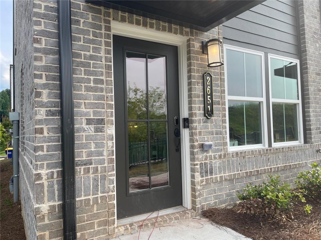 a view of a door of a house with a glass door