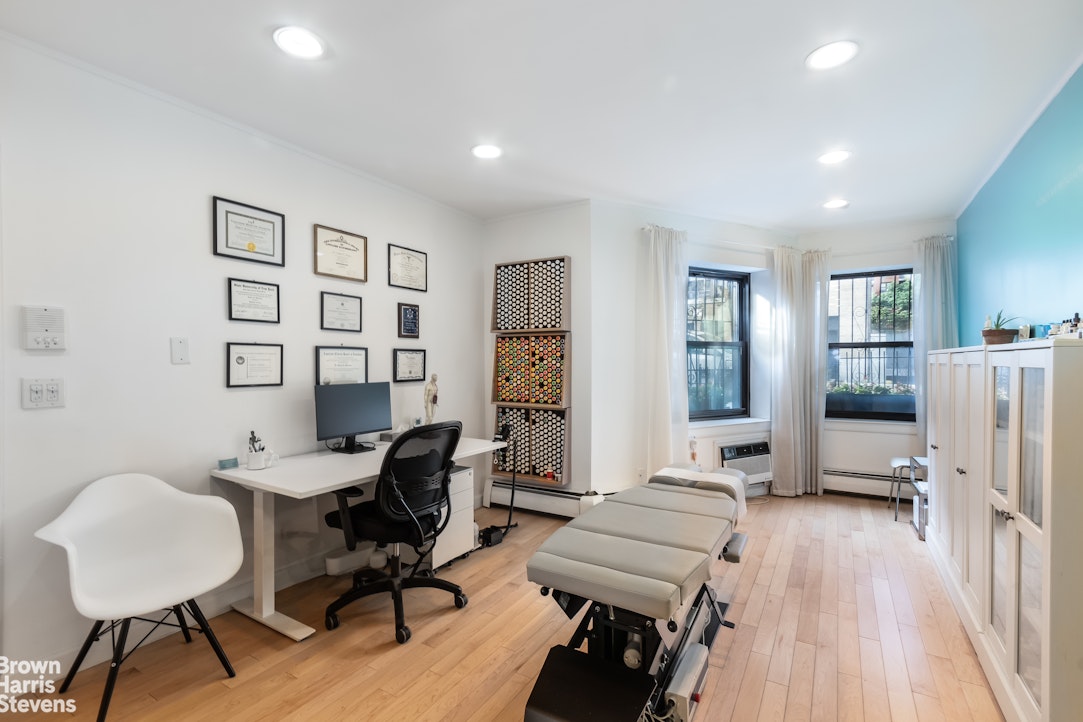 a workspace with furniture and wooden floor