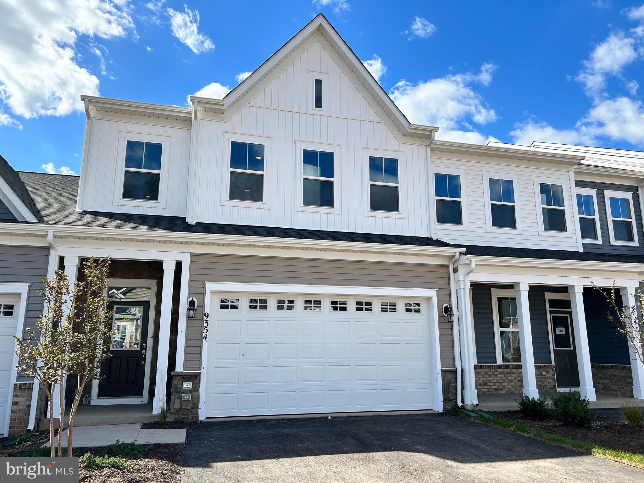 a front view of a house with a garage