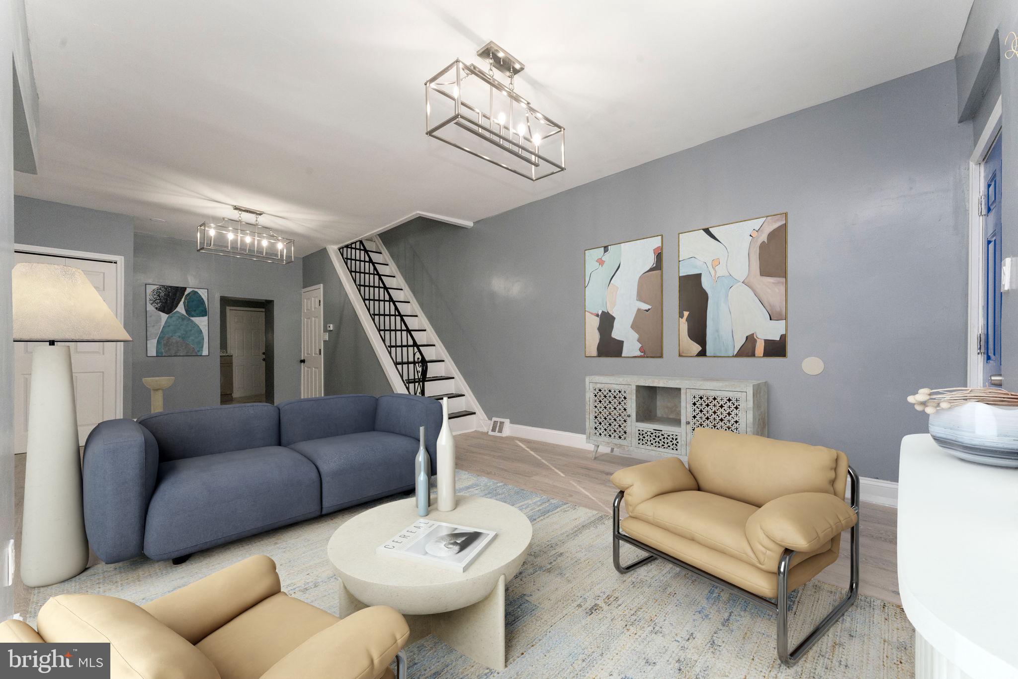 a living room with furniture a rug and a chandelier