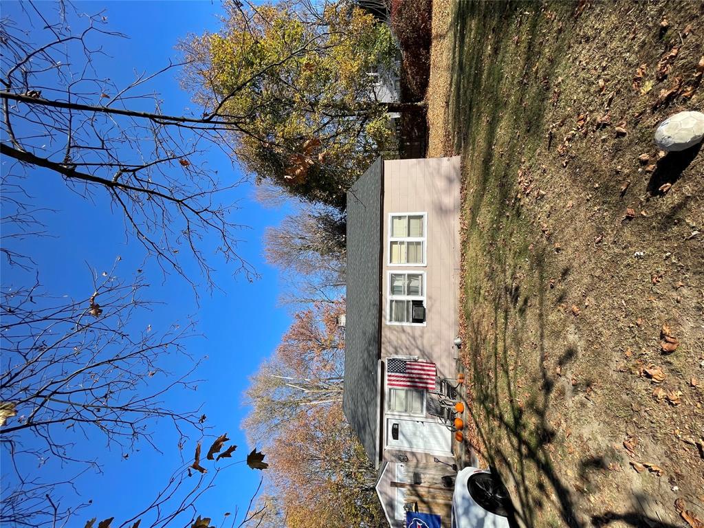 View of front of house featuring a front lawn