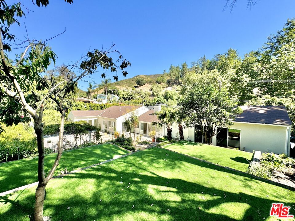 a view of a house with a big yard