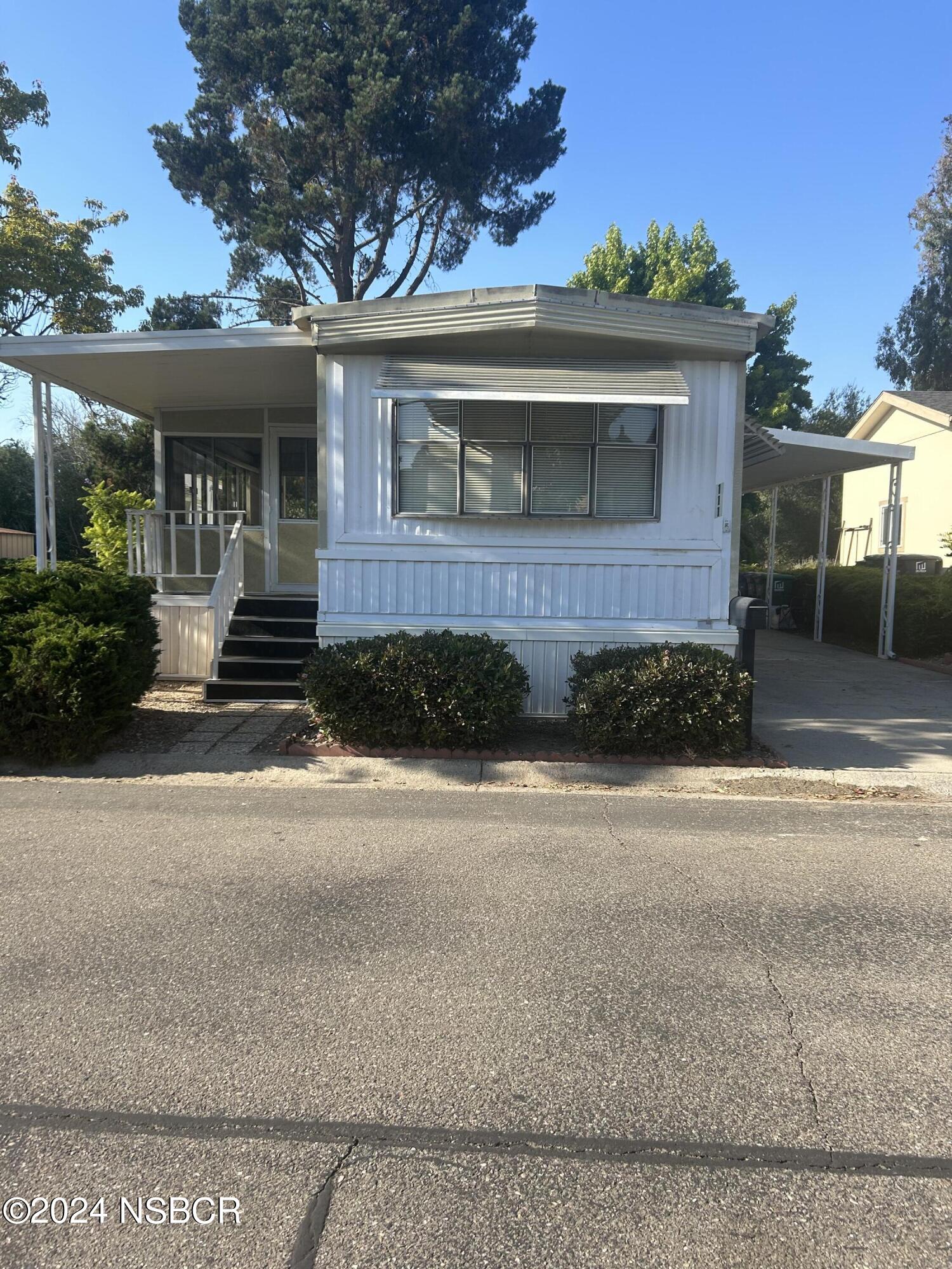 front view of a house with a small yard