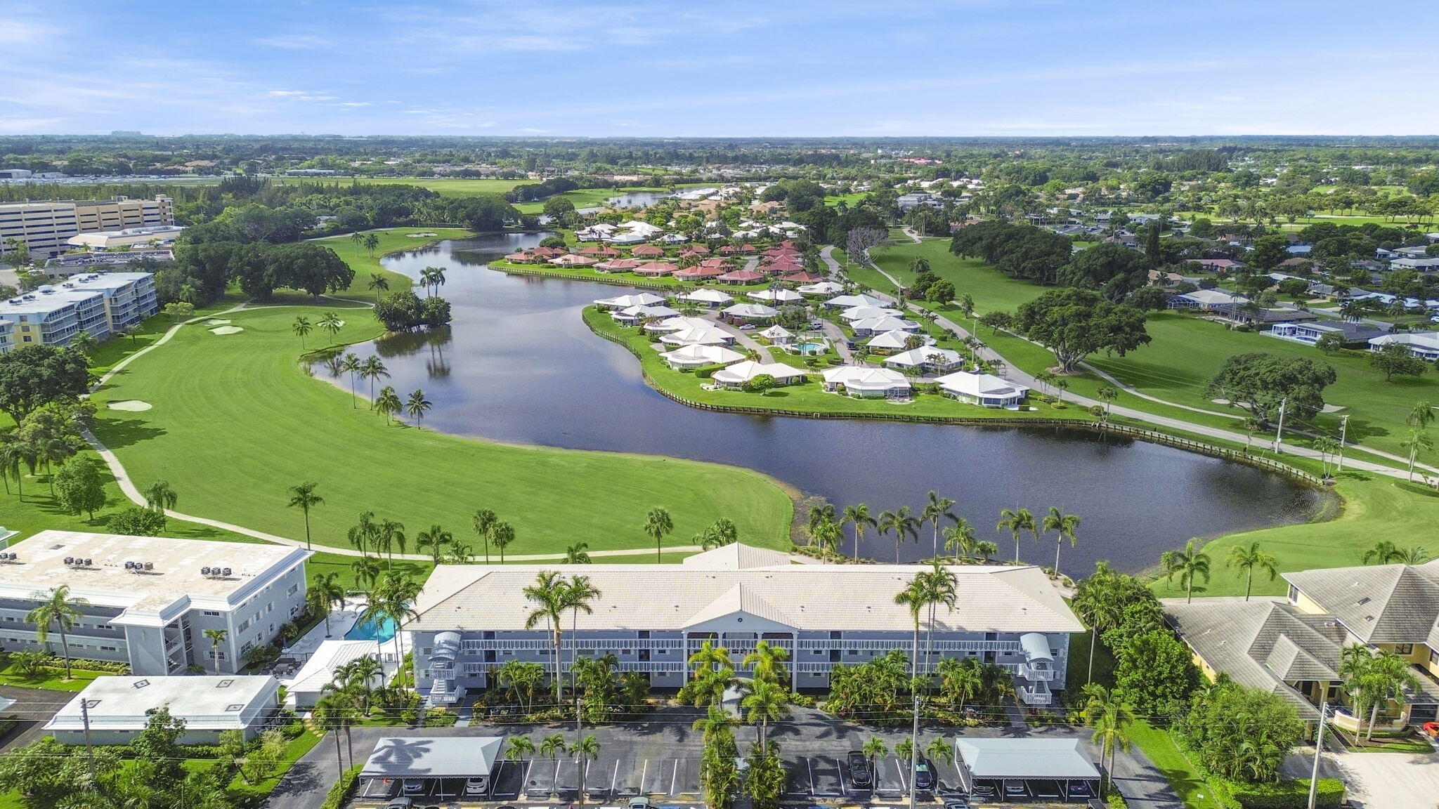 an aerial view of residential houses with outdoor space and river