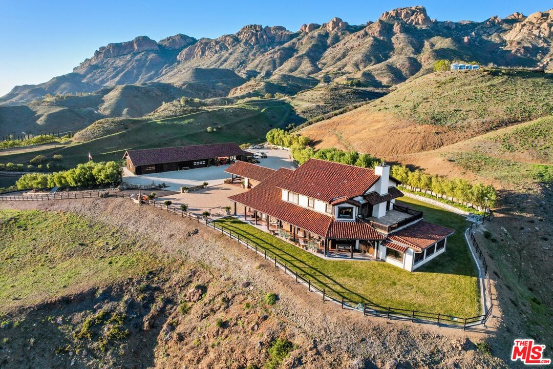 an aerial view of a house with a garden