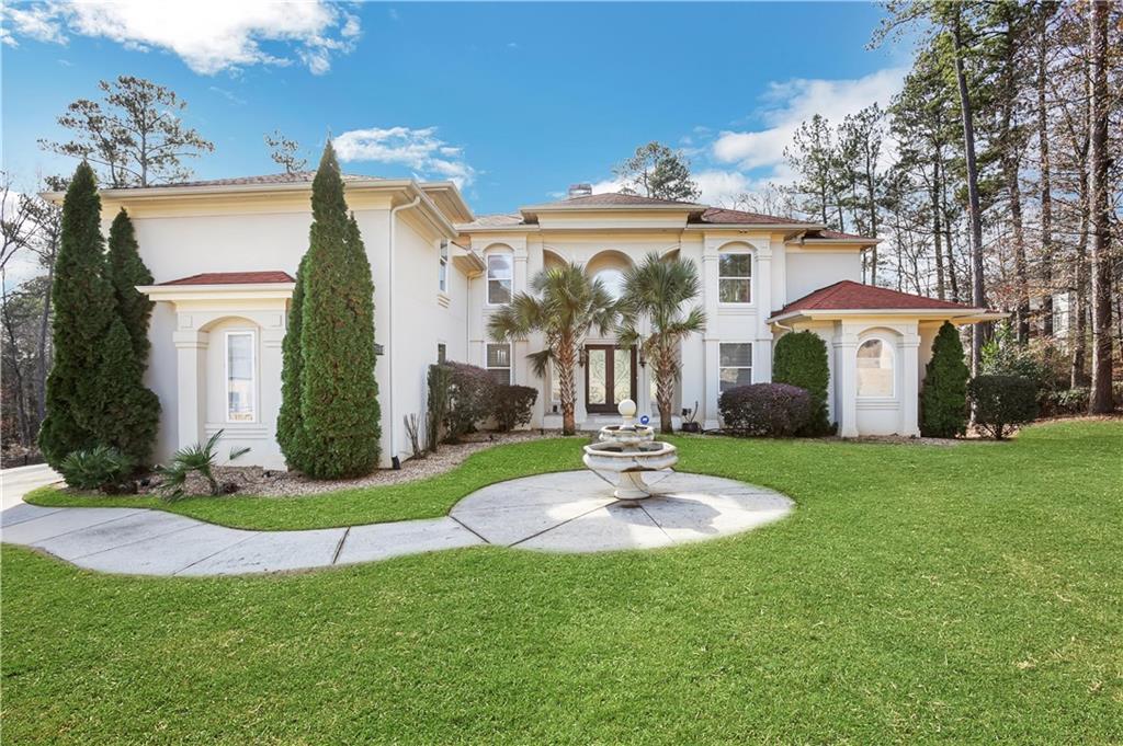 a front view of a house with a yard