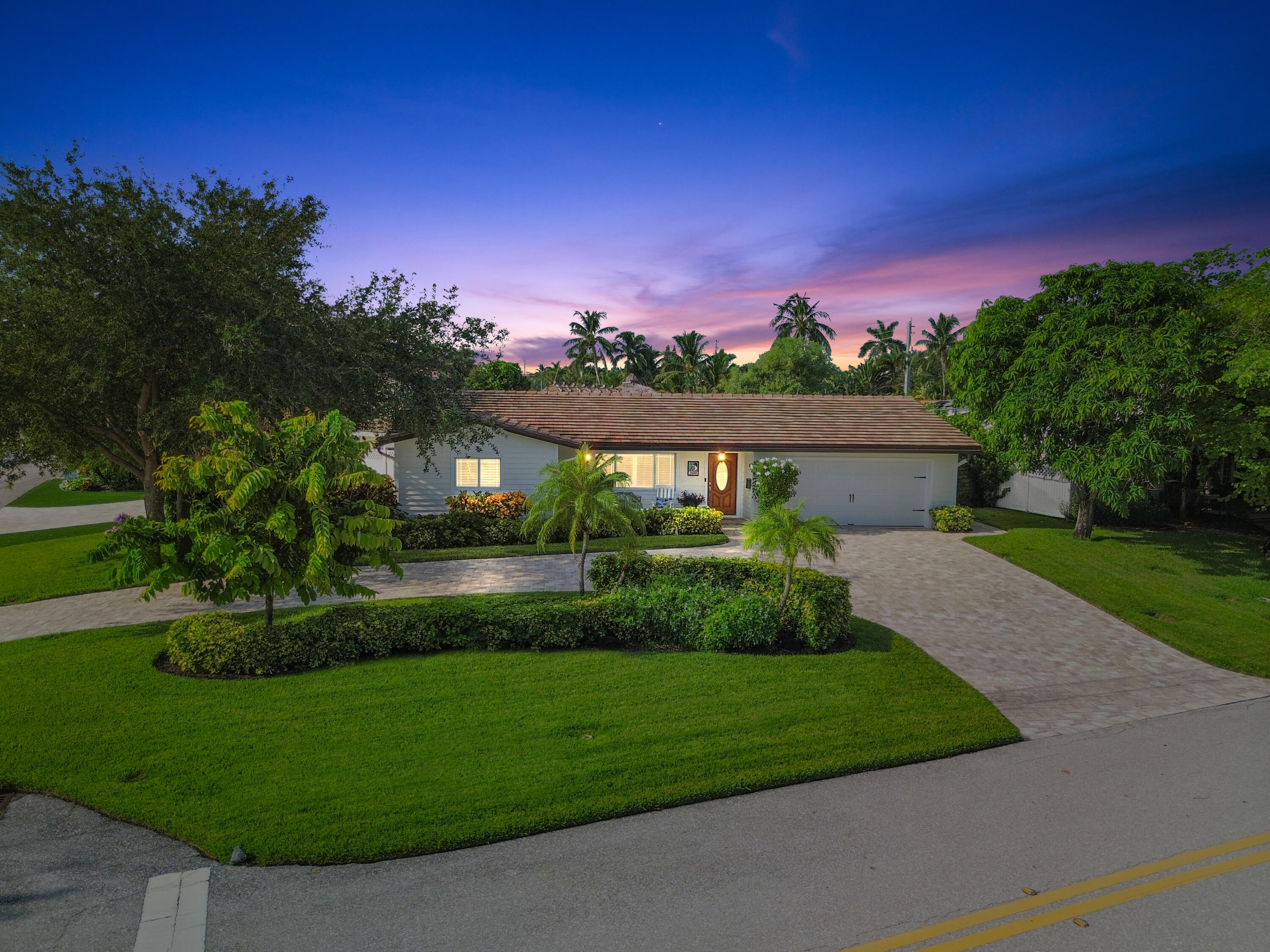 a view of a big house with a big yard