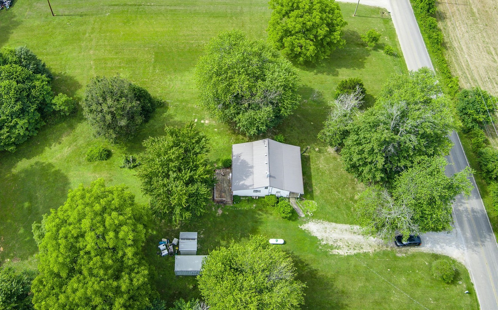 a backyard of a house with lots of green space