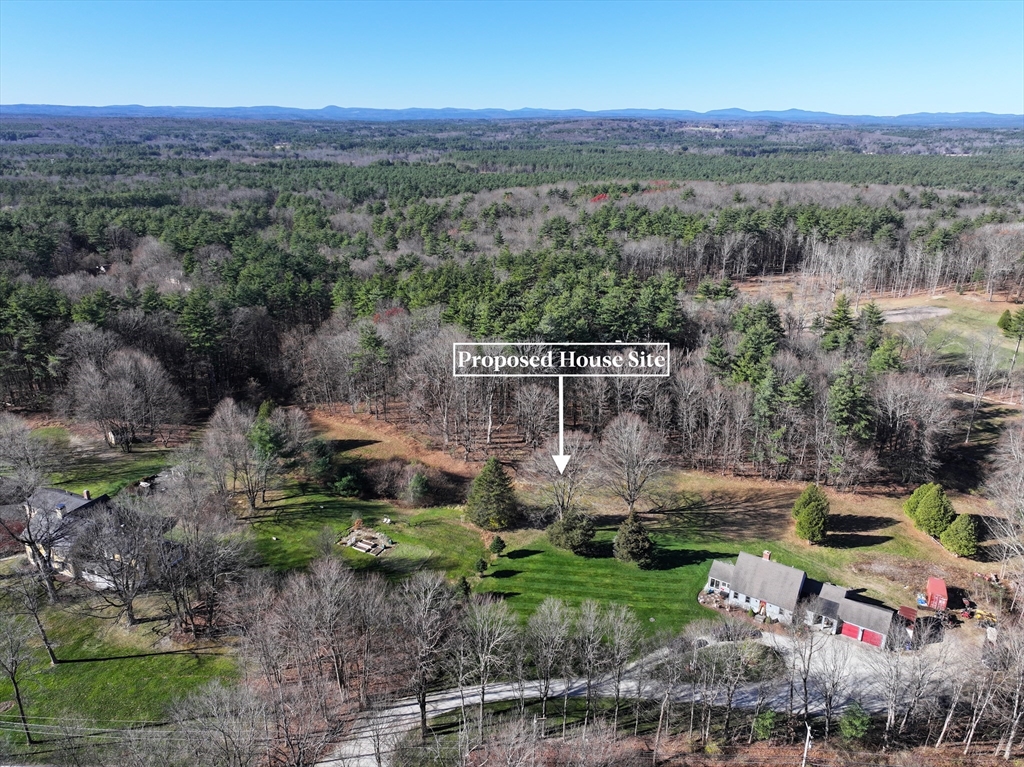 an aerial view of a house with a garden