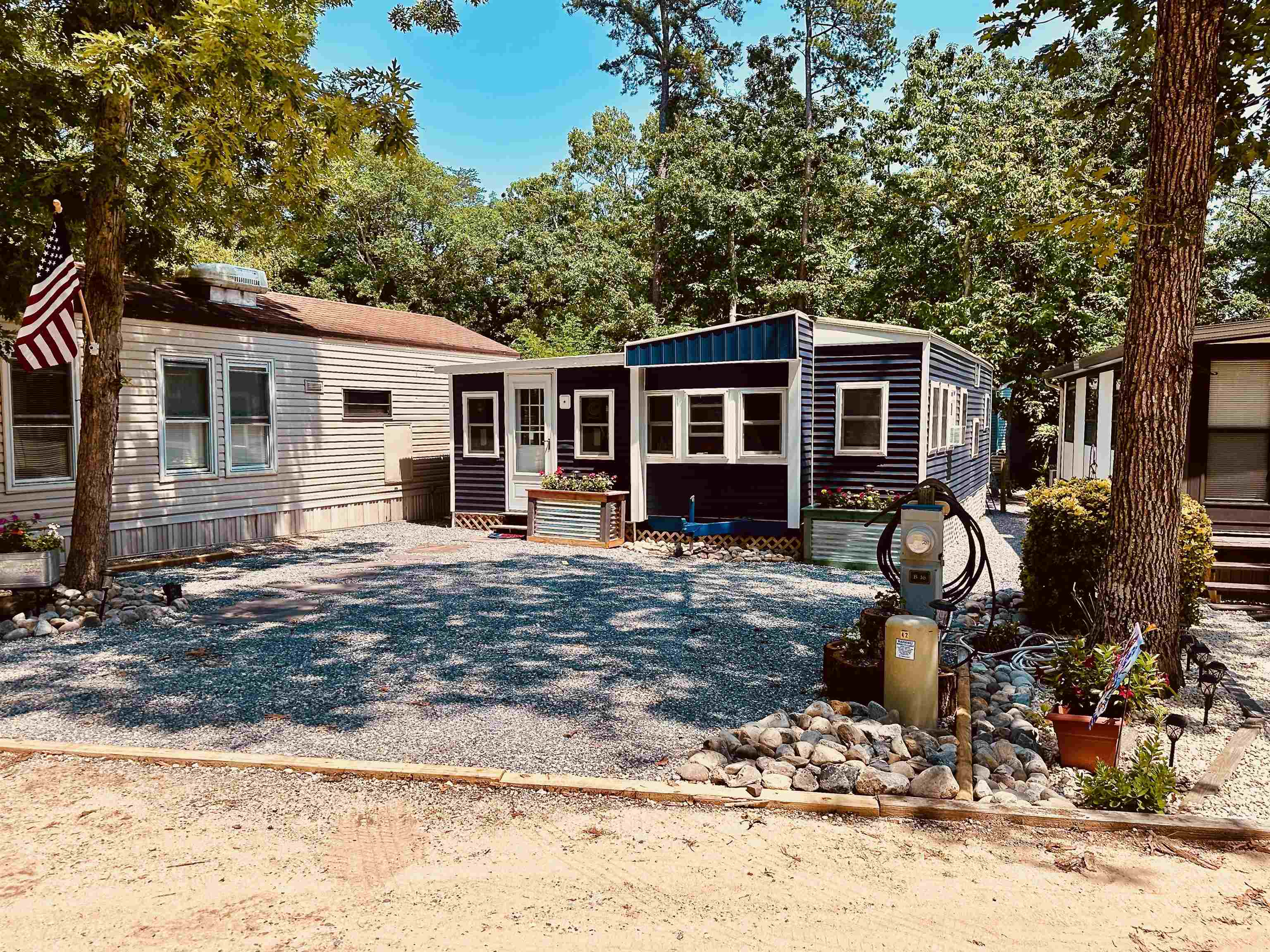 a front view of a house with patio yard and seating space