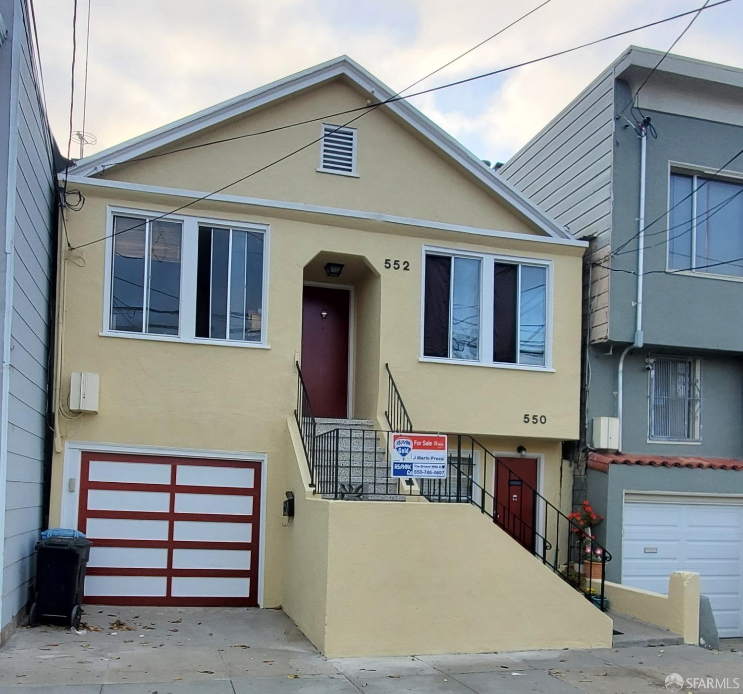 a front view of a house with a garage