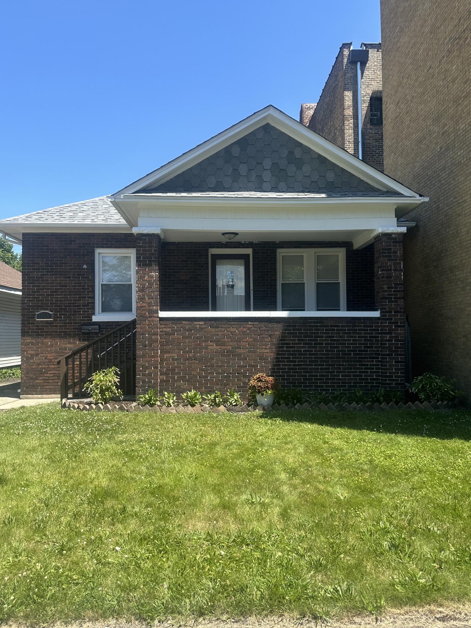 a front view of a house with yard