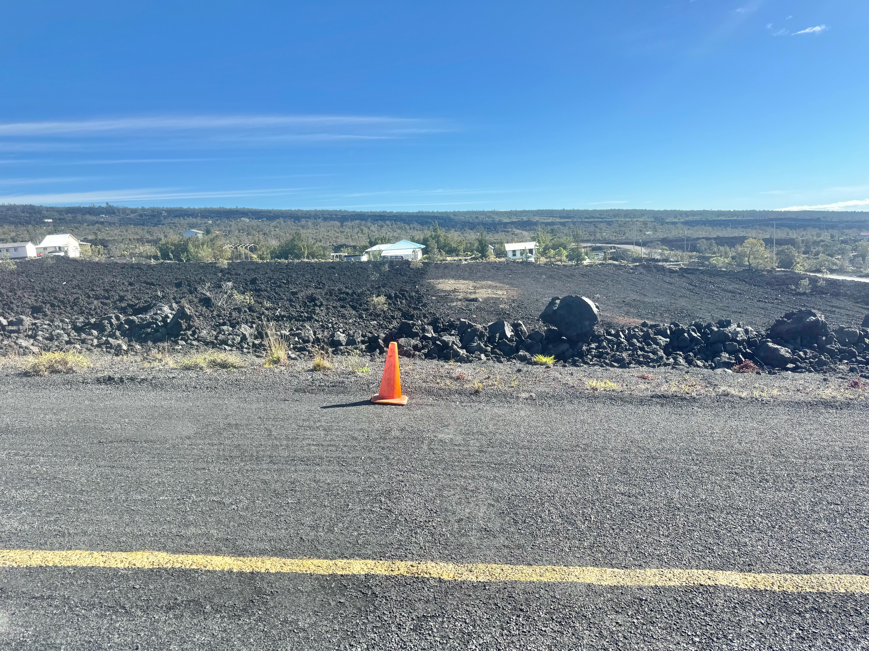 a view of a road with an ocean view