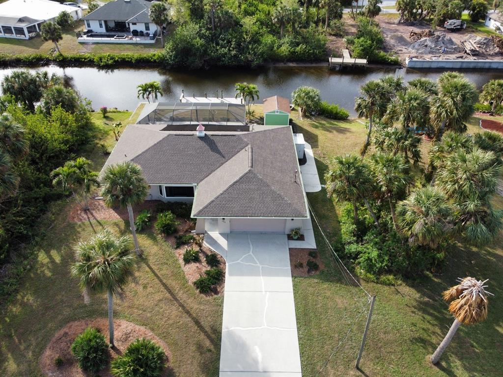 an aerial view of a house with a lake view