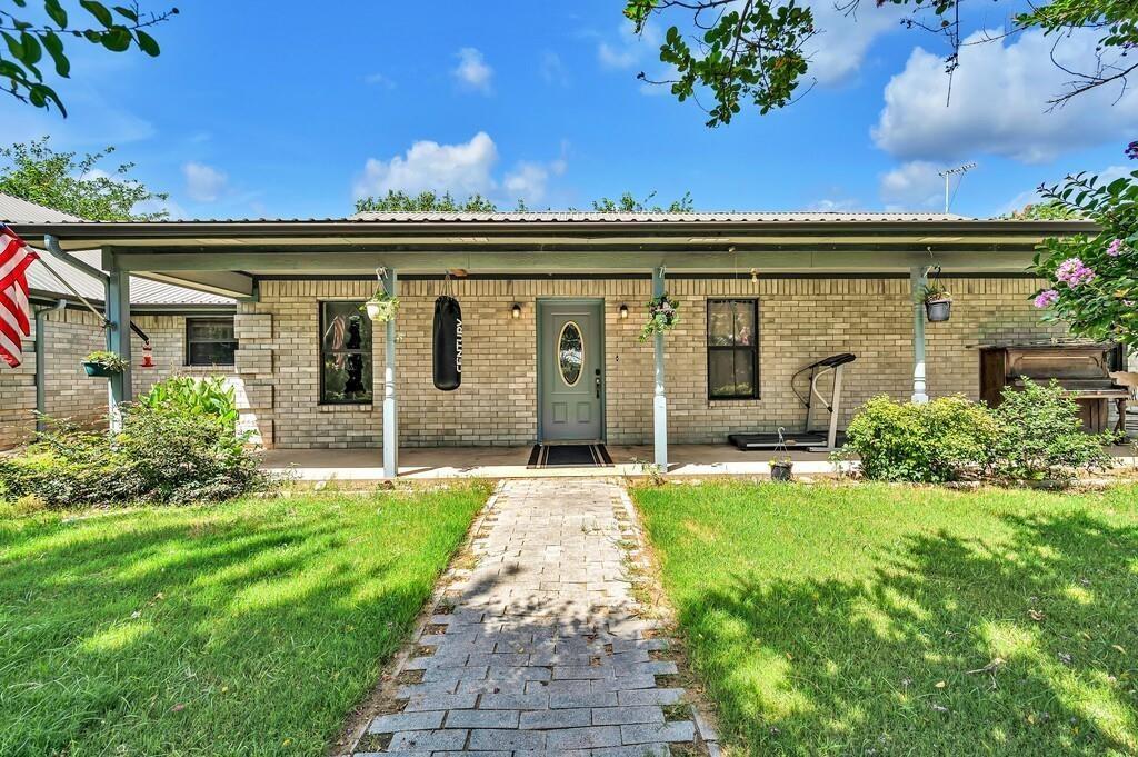 front view of a house with a big yard