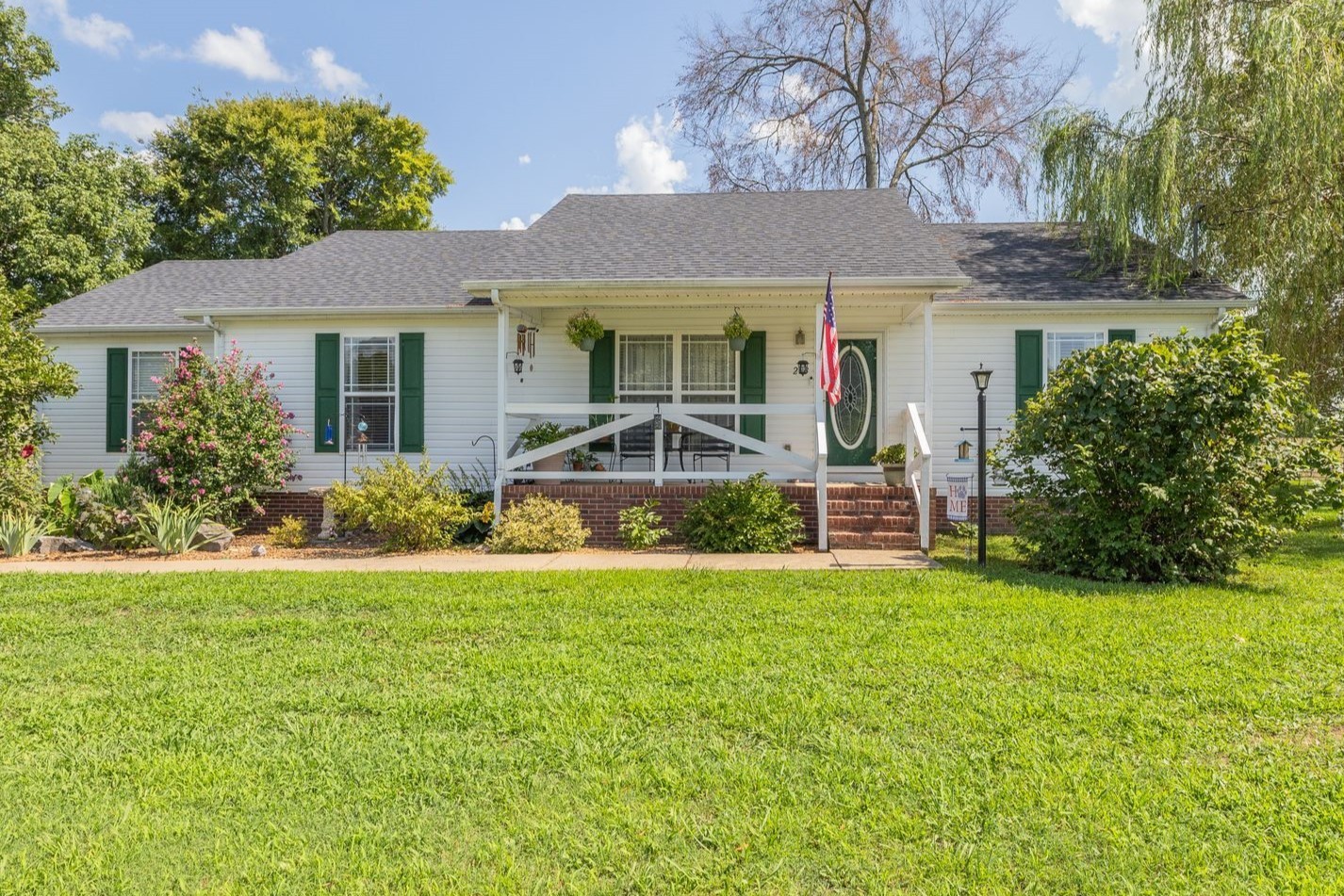 a front view of a house with garden