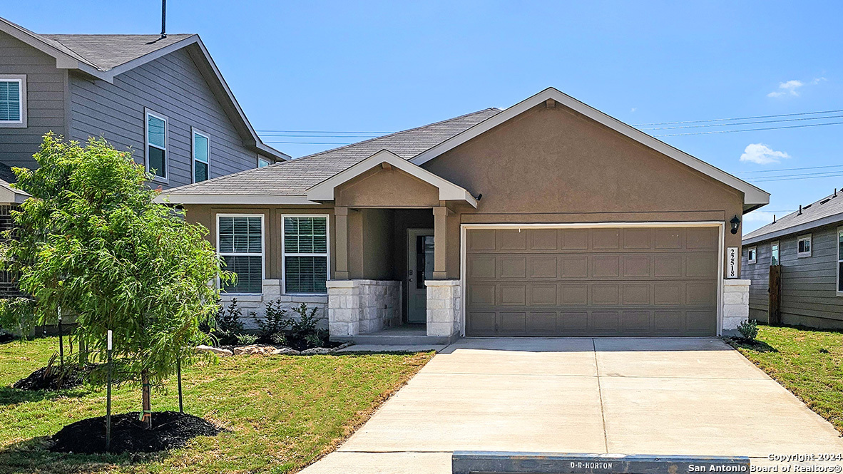 a front view of a house with a yard