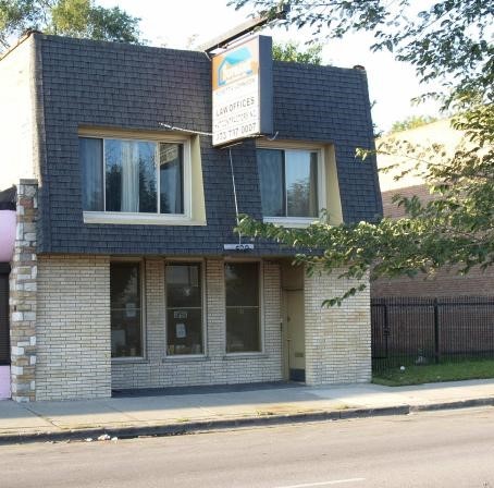 a front view of a house with garage