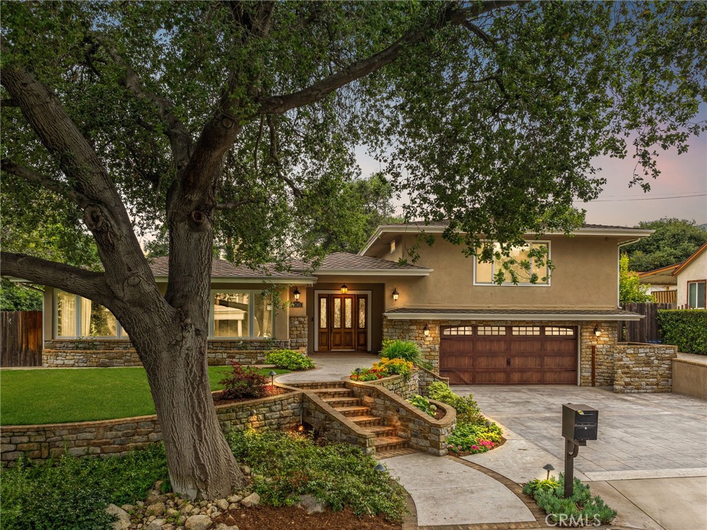 a front view of a house with garden