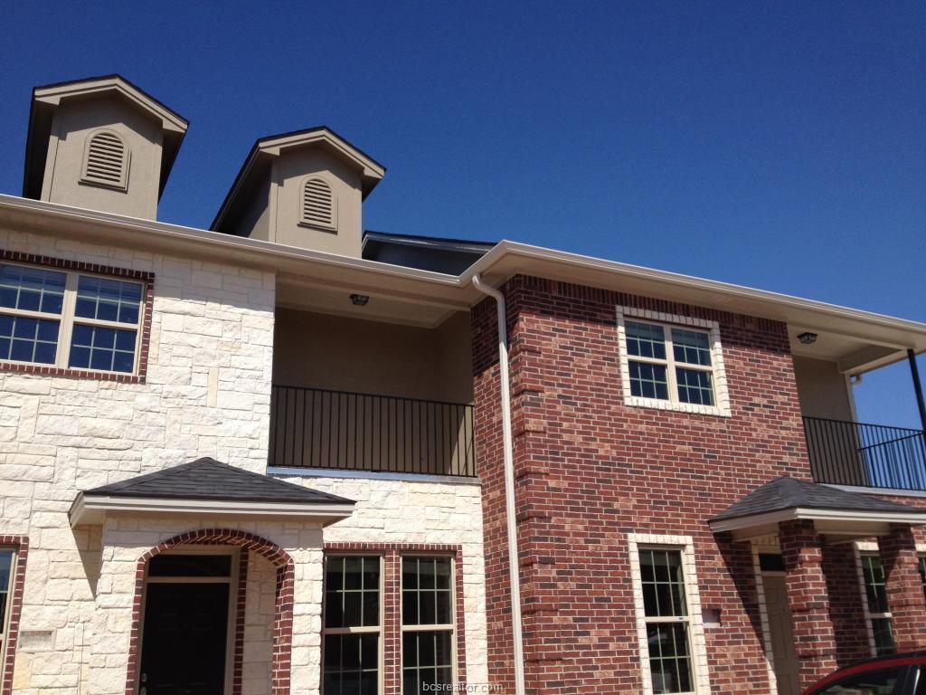 View of side of property featuring a balcony