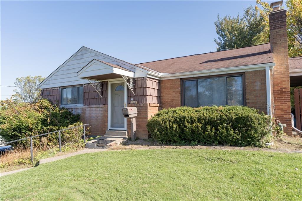 front view of a house with a yard