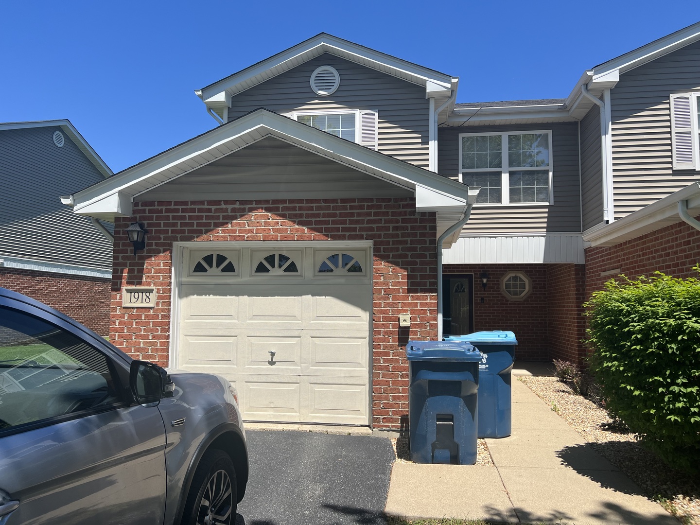 a front view of a house with parking area