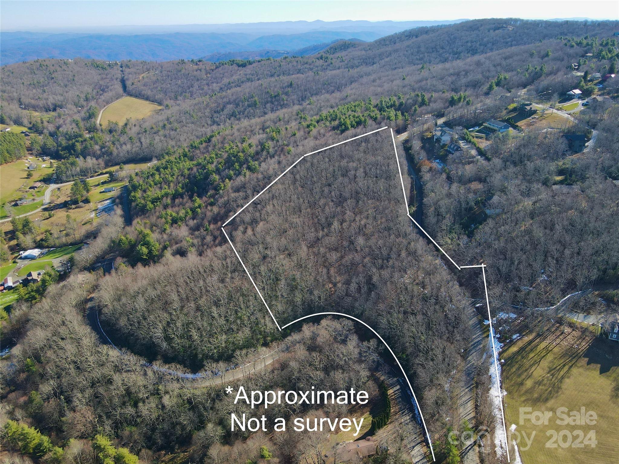 an aerial view of houses with outdoor space