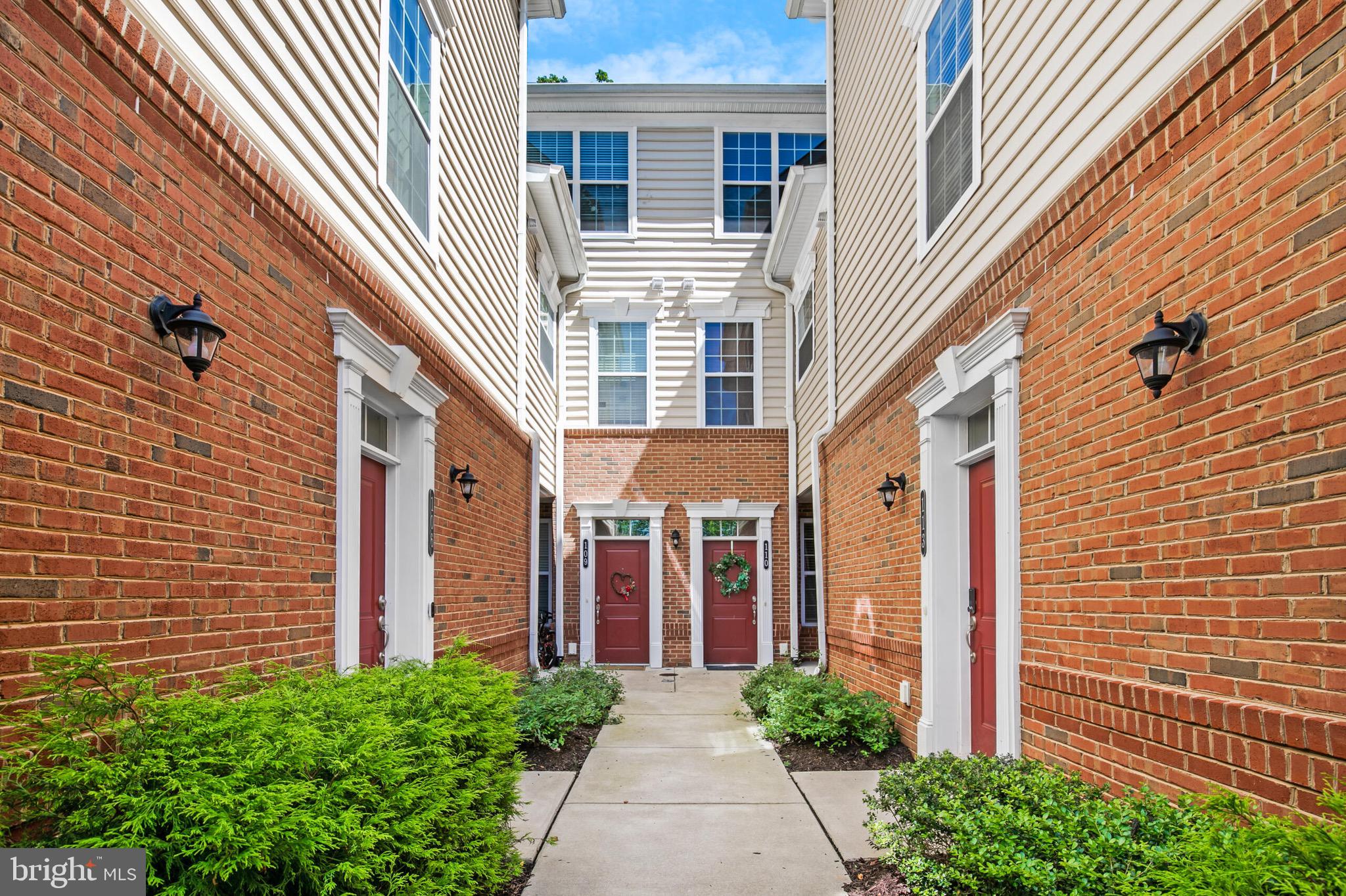 a view of a brick house with many windows