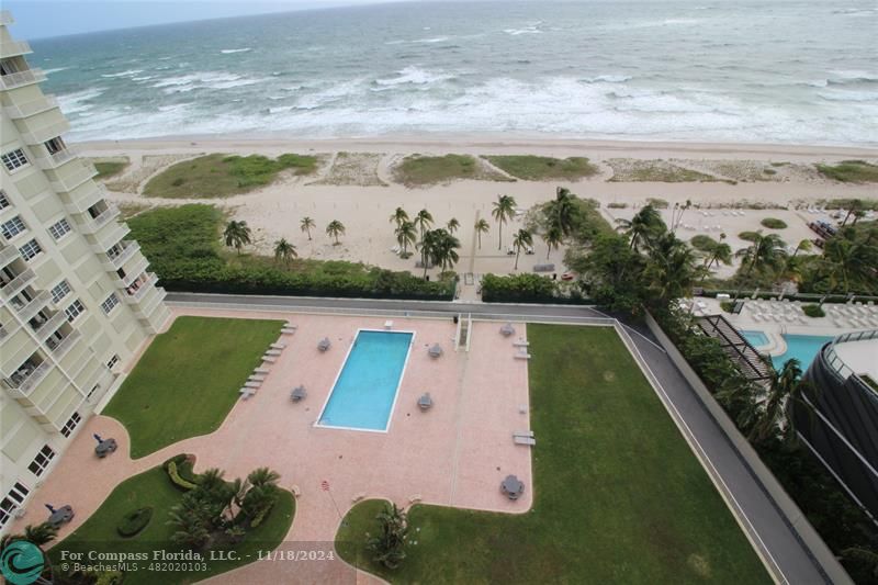 a view of swimming pool with a balcony