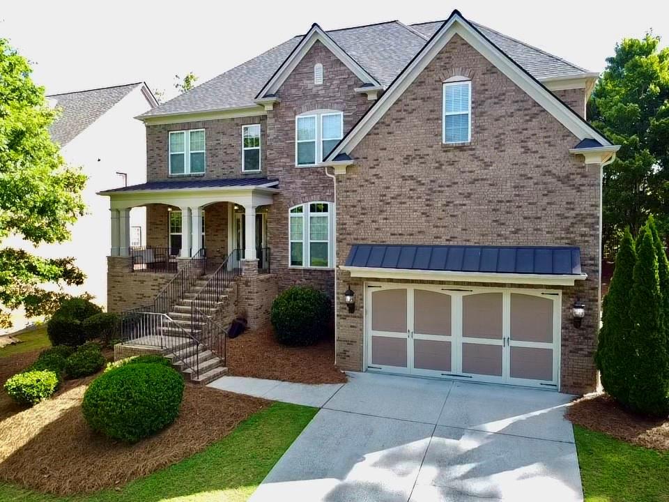 a front view of a house with garden