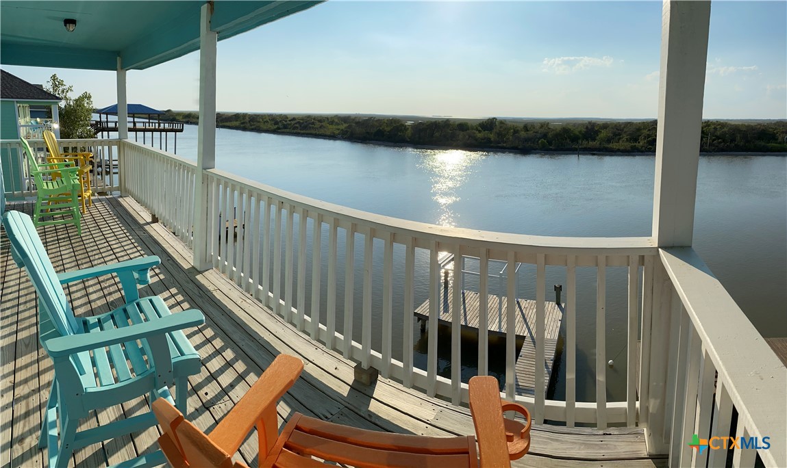 a view of balcony with furniture