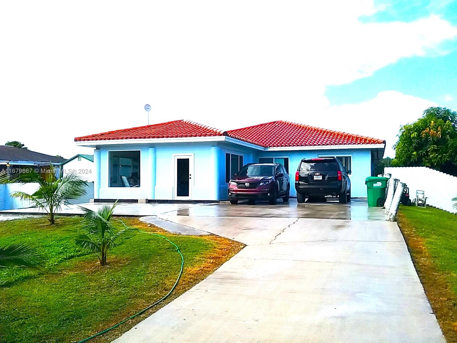 a view of house with swimming pool outdoor seating