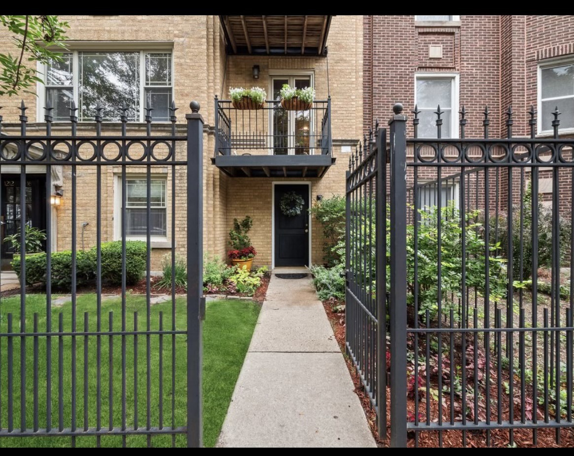 a view of a house with a garden and plants