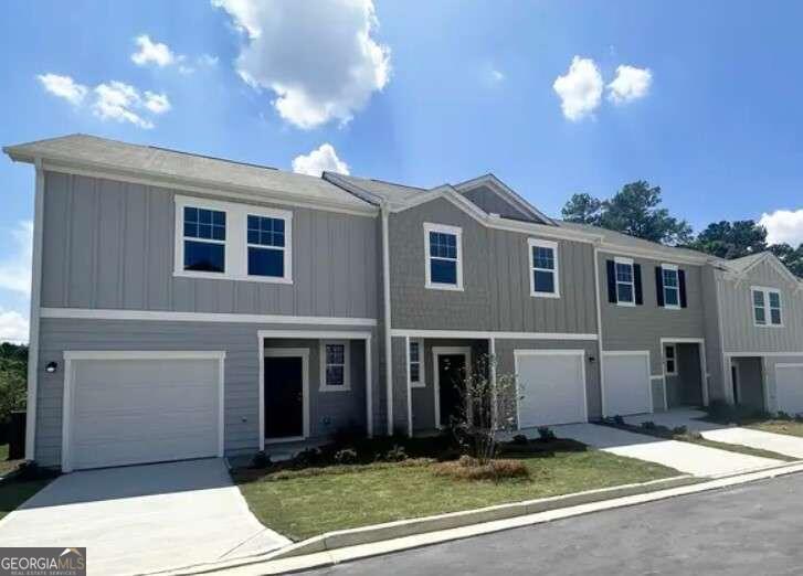 a front view of a house with yard