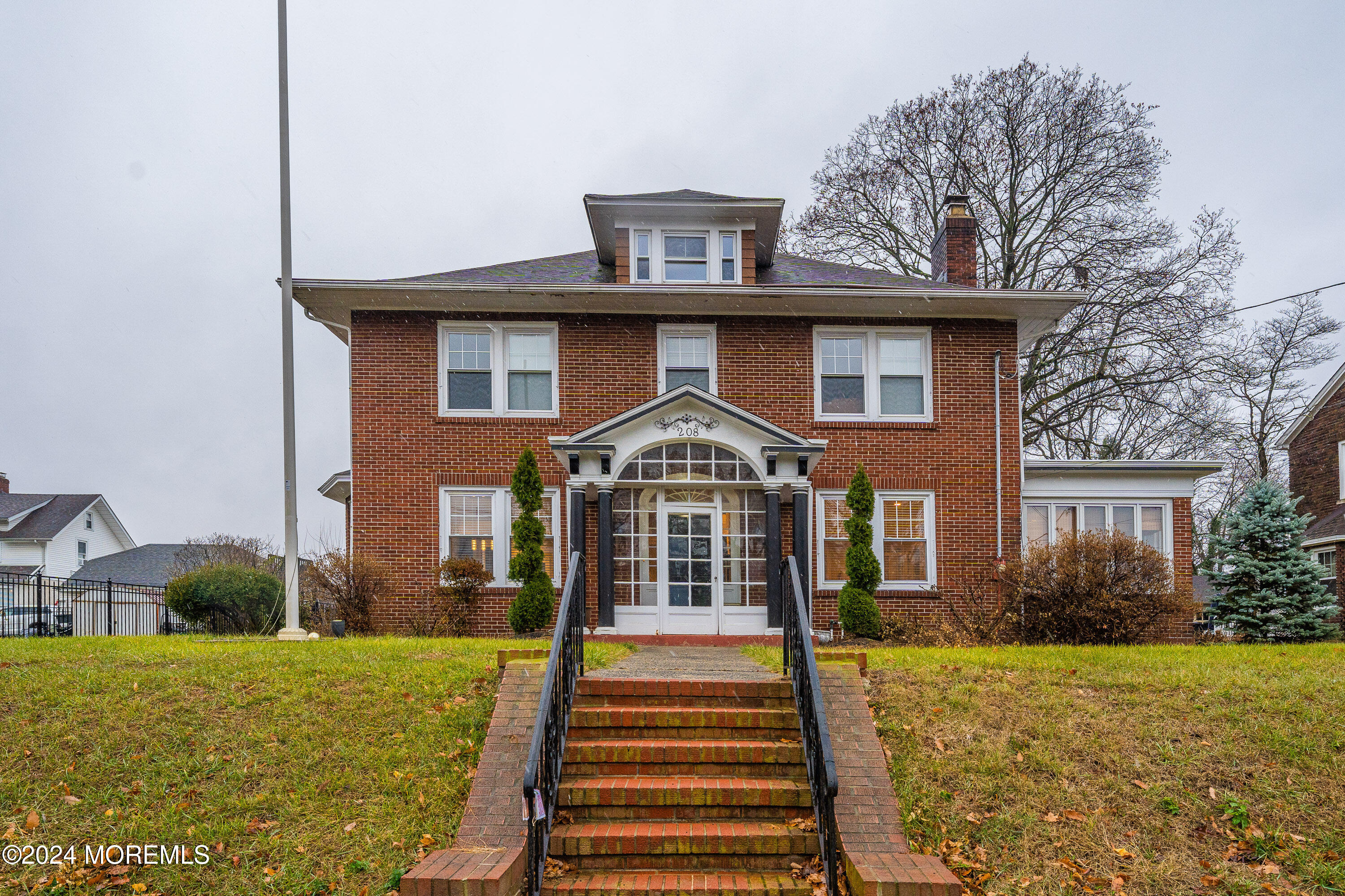 a front view of a house with a yard