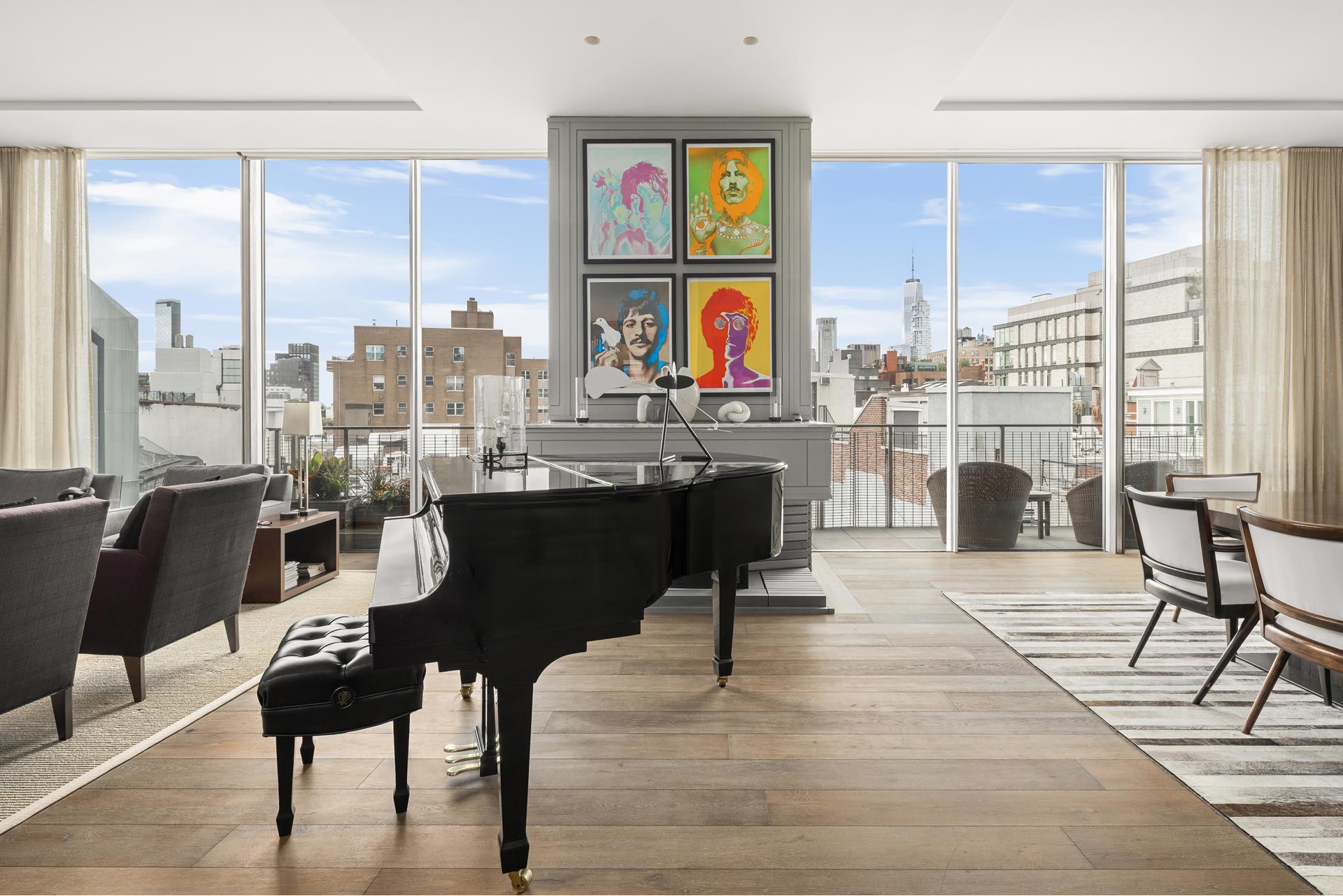 a living room with fireplace furniture and a floor to ceiling window