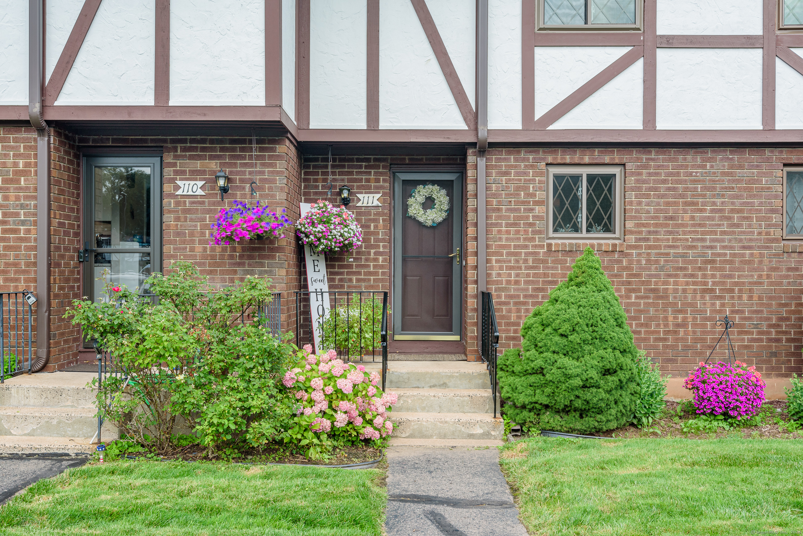 a front view of a house with yard