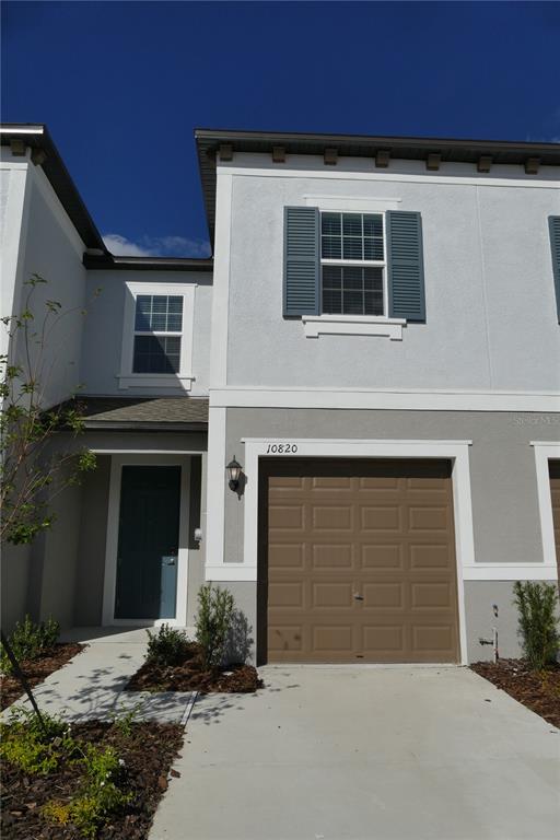 a front view of a house with a garage