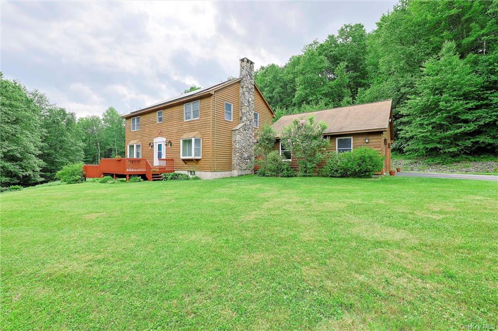 View of yard with a deck